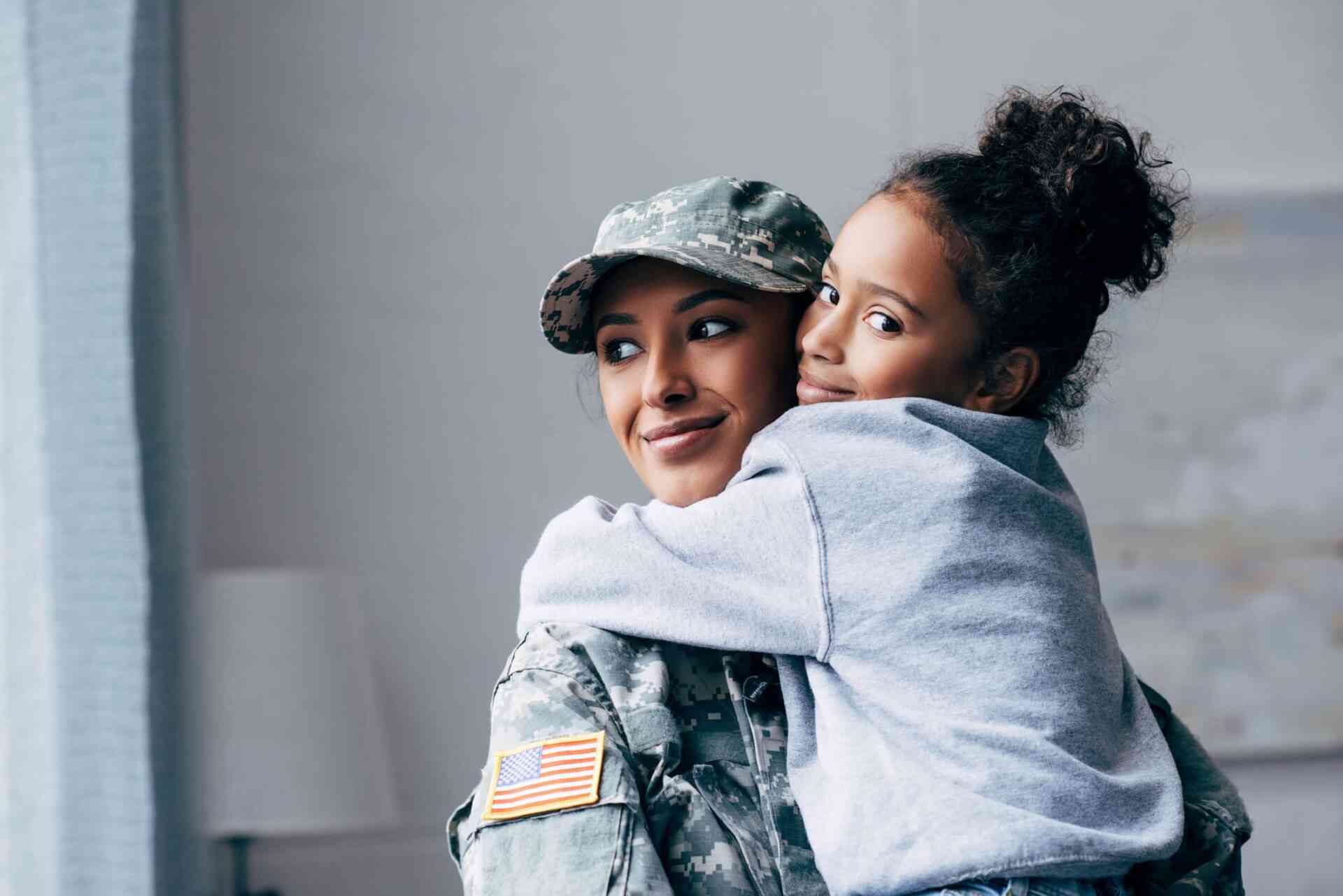 military woman with little girl